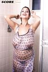 Solo girl Devon Daniels gets wet while unleashing massive tits in shower