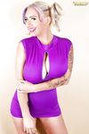 Curvy blonde in purple dress September Carrino takes one of her huge tits out