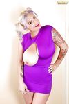 Curvy blonde in purple dress September Carrino takes one of her huge tits out