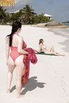 Plump female Christy Mark and her big boobed friend have lesbian sex on beach