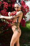 Tattooed latina Angelina Valentine poses outdoors and then takes a sexy shower with her forms