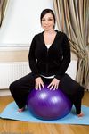 Hot busty plump Michelle B doffs yoga pants to spread naked on her mat