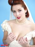 Natural redhead Lucy V slips off her wedding dress to bare big natural tits