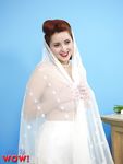 Natural redhead Lucy V slips off her wedding dress to bare big natural tits