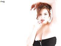Pornstar Tessa Fowler exposing huge all natural tits during solo girl spread