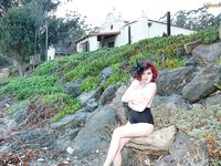 Leggy redhead pornstar Tessa Fowler touting huge natural tits outdoors