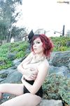 Leggy redhead pornstar Tessa Fowler touting huge natural tits outdoors