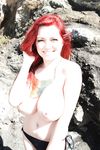 Redhead beach babe Tessa Fowler flaunting huge natural tits outdoors