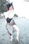 Busty redhead Tessa Fowler flashing her huge knockers on beach