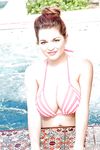 Incredibly busty beauty Tessa Fowler posing in a swimming pool