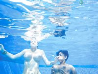 Underwater shots of big titted cuties and their lovely shaved snatches