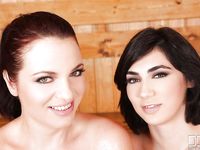 Two babes suck their sweaty massive boobies in a sauna