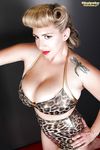 Tattooed blonde September Carrino is demonstrating her giant big boobs