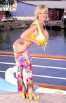Famous pornstar Busty Dusty unleashes her giant tits on the dock