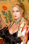 Big boobed blonde Kelly Madison	dresses as a Geisha prior to masturbating