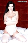 Brunette solo model Sha Rizel touts her nice melons wearing white stockings