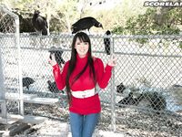 Asian girl with long hair Hitomi fills out her red sweater in non nude action