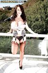 Chubby brunette boob model Leanne Crow posing outdoors in hose and garters