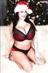 Sexy topless Christmas photo shoot with busty brunette Leanne Crow