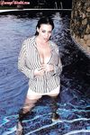 Hairy twat of Linsey Dawn McKenzie shown while cleaning the pool.