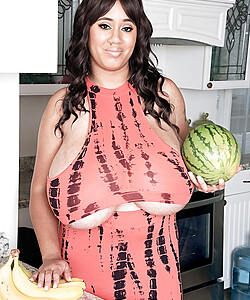 MILF Roxi Red shows off her giant melons that are much bigger than watermelons