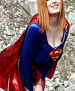 Thick redhead Alexsis Faye releases her giant tits from Superman osutfit