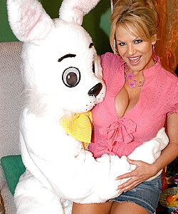 Big boobed blonde chick gets banged by a guy in a rabbit costume