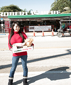 Asian girl with long hair Hitomi fills out her red sweater in non nude action