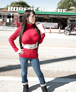 Asian girl with long hair Hitomi fills out her red sweater in non nude action