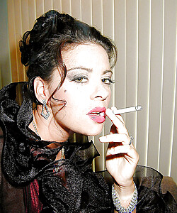 Busty stocking and lingerie clad MILF Linsey Dawn McKenzie having a smoke