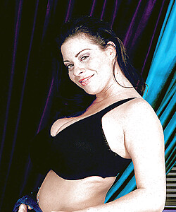 Linsey Dawn McKenzie takes off her black lingerie and exposes her big tits.