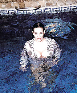 Hairy twat of Linsey Dawn McKenzie shown while cleaning the pool.