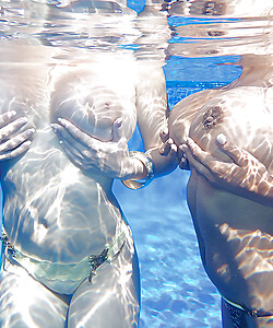 Underwater shots of big titted cuties and their lovely shaved snatches