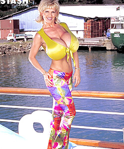 Famous pornstar Busty Dusty unleashes her giant tits on the dock